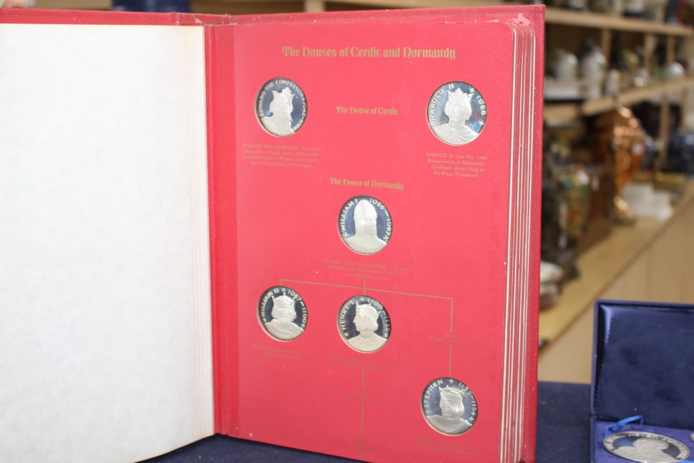 A set of the Kings and Queens of England sterling silver proof medallions, housed in original album and three other cased sets